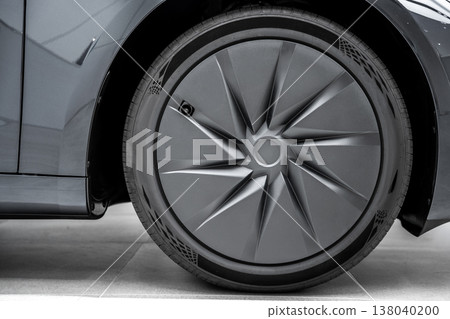 Close-up of black rear tire wheel electric car. Close-up of black rear tire wheel electric car. 138040200