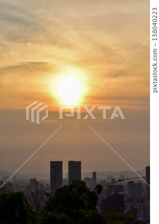 Aerial view of skyline of Taipei city with beautiful sun at sunset from Xiangshan Elephant Mountain. Beautiful landscape and cityscape of Taipei downtown and beautiful nature scene. 138040223