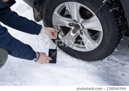 Portable Car Air Compressor. Cordless Tire Inflator Auto Portable Car Air Compressor. Cordless Tire Inflator Auto 138040394