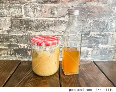 Lemon paste and lemon syrup. Candied lemon paste and honey-preserved lemon syrup. 138041110