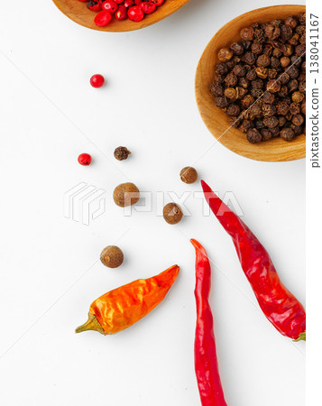 Different types of spices arranged on a white surface in a bright setting Different types of spices arranged on a white surface in a bright setting 138041167