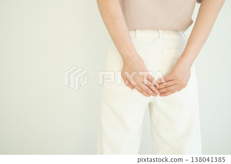 Woman suffering from anal pain and discomfort. Cause of pain include hemorrhoid, anal fissure, diarrhea, constipation or Crohn's disease. Gastrointestinal system concept. Woman suffering from anal pain and discomfort. Cause of pain include hemorrhoid, anal fissure, diarrhea, constipation or Crohn's disease. Gastrointestinal system concept. 138041385