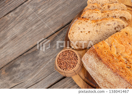 Sliced Seeded Bread Loaf on Wooden Board Sliced Seeded Bread Loaf on Wooden Board 138041467