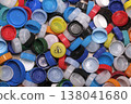 Large pile of colorful plastic bottle caps for recycling 138041680