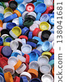 Large pile of colorful plastic bottle caps for recycling 138041681