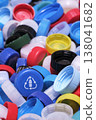 Large pile of colorful plastic bottle caps for recycling 138041682