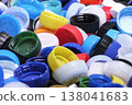 Large pile of colorful plastic bottle caps for recycling 138041683