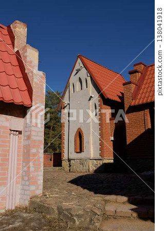 Quiet And Secluded Street Displaying Illuminated Cobblestones Alongside Charming Architectural Ornamentation Quiet And Secluded Street Displaying Illuminated Cobblestones Alongside Charming Architectural Ornamentation 138041918