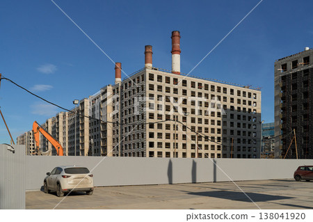 Urban Building Progress. Construction Zone Under Blue Sky. City Redevelopment With Cranes And Structures 138041920