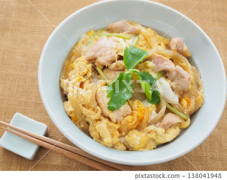 Oyakodon topped with mitsuba (Japanese parsley) Oyakodon topped with mitsuba (Japanese parsley) 138041948