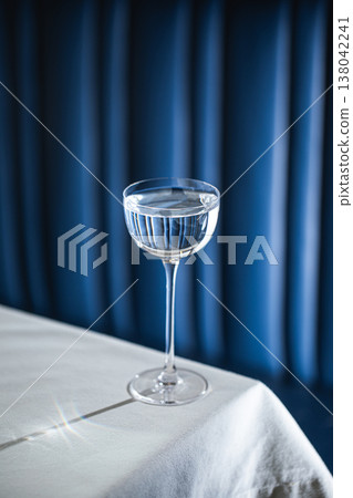 Clear cocktail in elegant glass on table Clear cocktail in elegant glass on table 138042241