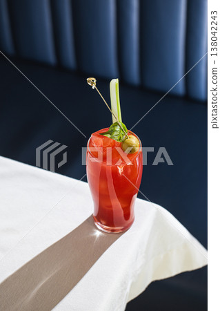 Bloody mary cocktail with celery and olive garnish Bloody mary cocktail with celery and olive garnish 138042243