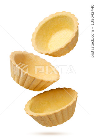 Tartlets falling close-up on a white. Isolated Tartlets falling close-up on a white. Isolated 138042440