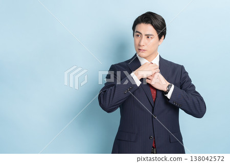 Cool businessman (blue background) 138042572