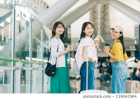 Three women inside the airport. "Filming assistance provided by: Kansai International Airport (KIX)" Three women inside the airport. "Filming assistance provided by: Kansai International Airport (KIX)" 138042964