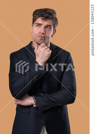 Thinking Businessman Looking Up, Searching Opportunity On Beige Background Thinking Businessman Looking Up, Searching Opportunity On Beige Background 138043125