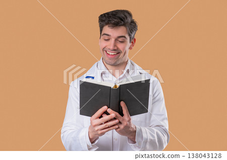 Doctor man reading book with focused view on beige. Discovery, education time 138043128