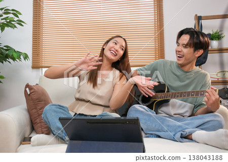 A young Asian couple spend time together at home A young Asian couple spend time together at home 138043188