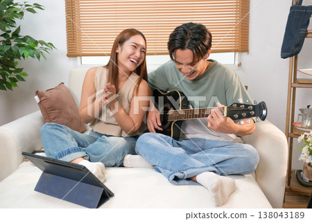A young Asian couple spend time together at home A young Asian couple spend time together at home 138043189