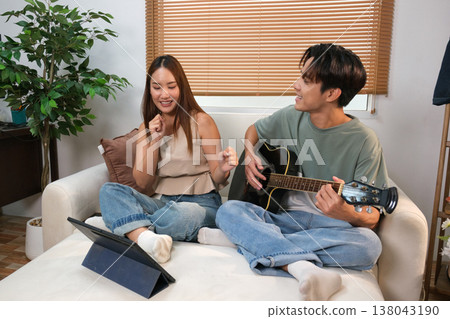 A young Asian couple spend time together at home A young Asian couple spend time together at home 138043190