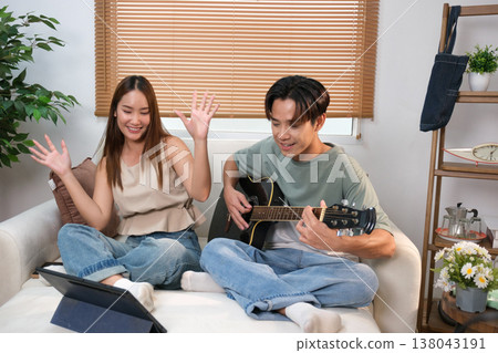 A young Asian couple spend time together at home A young Asian couple spend time together at home 138043191