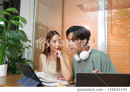 A young Asian couple spend time together at home A young Asian couple spend time together at home 138043194