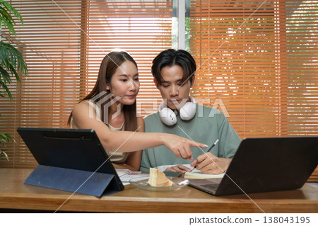 A young Asian couple spend time together at home A young Asian couple spend time together at home 138043195