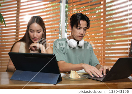 A young Asian couple spend time together at home A young Asian couple spend time together at home 138043196