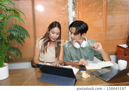 A young Asian couple spend time together at home A young Asian couple spend time together at home 138043197