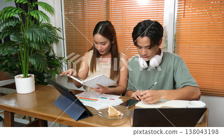 A young Asian couple spend time together at home A young Asian couple spend time together at home 138043198