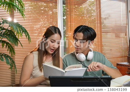 A young Asian couple spend time together at home A young Asian couple spend time together at home 138043199