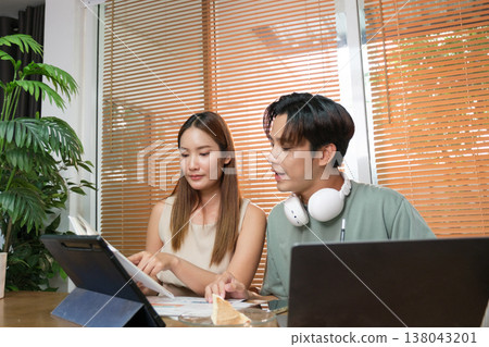 A young Asian couple spend time together at home A young Asian couple spend time together at home 138043201