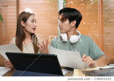 A young Asian couple spend time together at home A young Asian couple spend time together at home 138043203