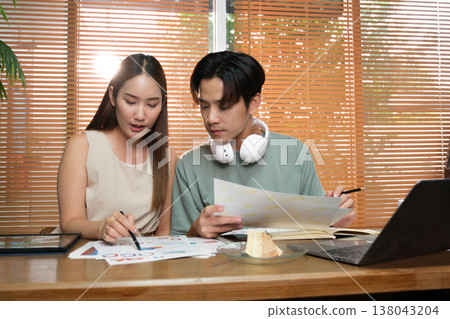 A young Asian couple spend time together at home A young Asian couple spend time together at home 138043204
