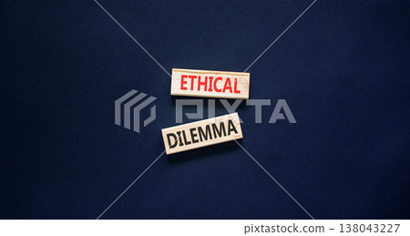 Ethical dilemma words symbol. Concept words Ethical dilemma on beautiful wooden blocks. Beautiful black background. Business and Ethical dilemma words concept. Copy space. 138043227