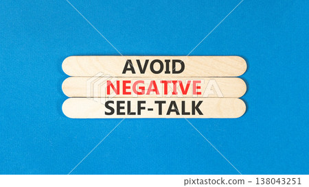 Avoid negative self-talk symbol. Concept words Avoid negative self-talk on beautiful wooden sticks. Beautiful blue background. Business psychology avoid negative self-talk concept. Copy space. 138043251