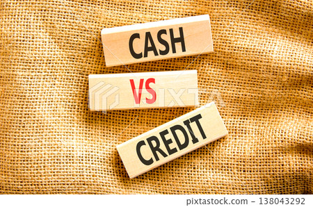 Cash vs credit words symbol. Concept words Cash vs credit on beautiful wooden blocks. Beautiful canvas background. Business and cash vs credit concept. Copy space. Cash vs credit words symbol. Concept words Cash vs credit on beautiful wooden blocks. Beautiful canvas background. Business and cash vs credit concept. Copy space. 138043292