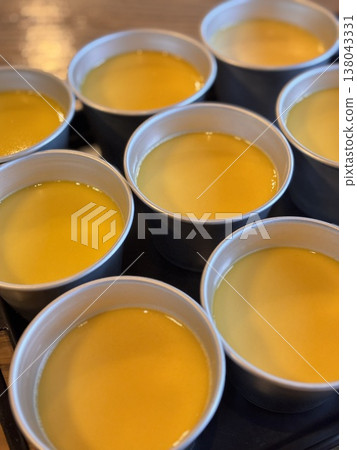 A row of custard puddings 138043331