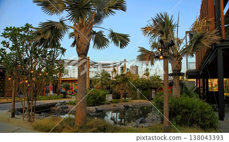 Dubai, UAE - May 06, 2018: La Mer at sunset. It is a new beachfront district with shopping and restaurants in Jumeirah. DUBAI, UAE -May 06, 2018 . Dubai, UAE - May 06, 2018: La Mer at sunset. It is a new beachfront district with shopping and restaurants in Jumeirah. DUBAI, UAE -May 06, 2018 . 138043393