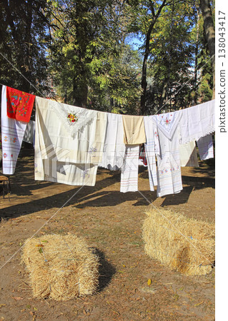 Linen tablecloths, towels, napkins  decorated with embroidery and lace. 138043417