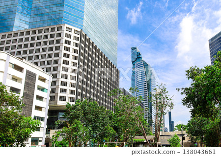 A cityscape with greenery and buildings 138043661