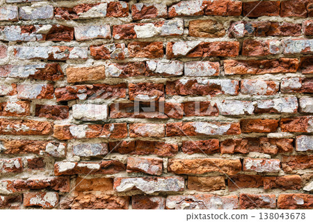 Uneven old red brick wall Uneven old red brick wall 138043678
