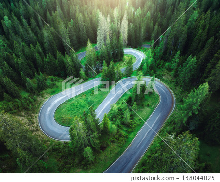 Aerial view of mountain snake road and green forest in summer Aerial view of mountain snake road and green forest in summer 138044025