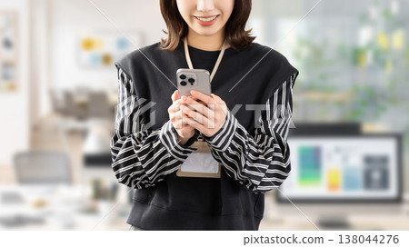 Women/businesswomen using smartphones Women/businesswomen using smartphones 138044276