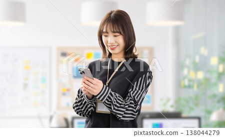 Women/businesswomen using smartphones Women/businesswomen using smartphones 138044279