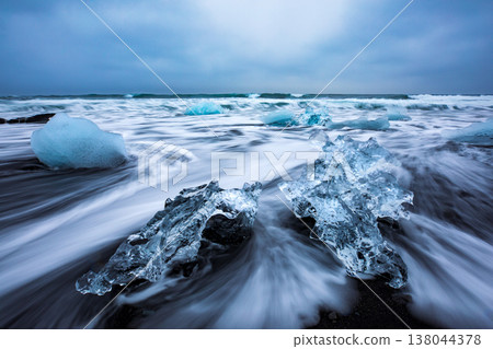 Icebergs floating on black volcanic beach, South Iceland Icebergs floating on black volcanic beach, South Iceland 138044378