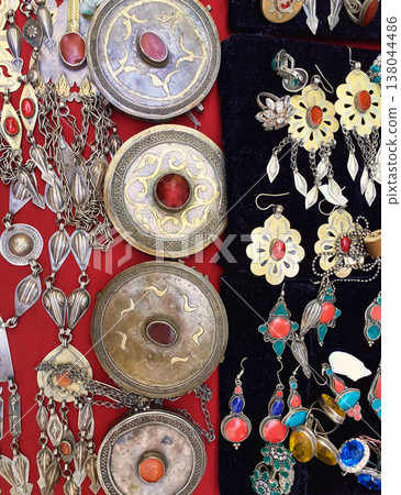 National woman jewelry made of silver and semi-precious stones. Turkmenistan. Ashkhabad market. National woman jewelry made of silver and semi-precious stones. Turkmenistan. Ashkhabad market. 138044486