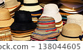 A variety of summer women's hats in a street market. 138044605