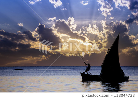 sailboat at sunset in Mauritius island sailboat at sunset in Mauritius island 138044728