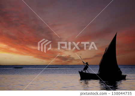 sailboat at sunset in Mauritius island sailboat at sunset in Mauritius island 138044735